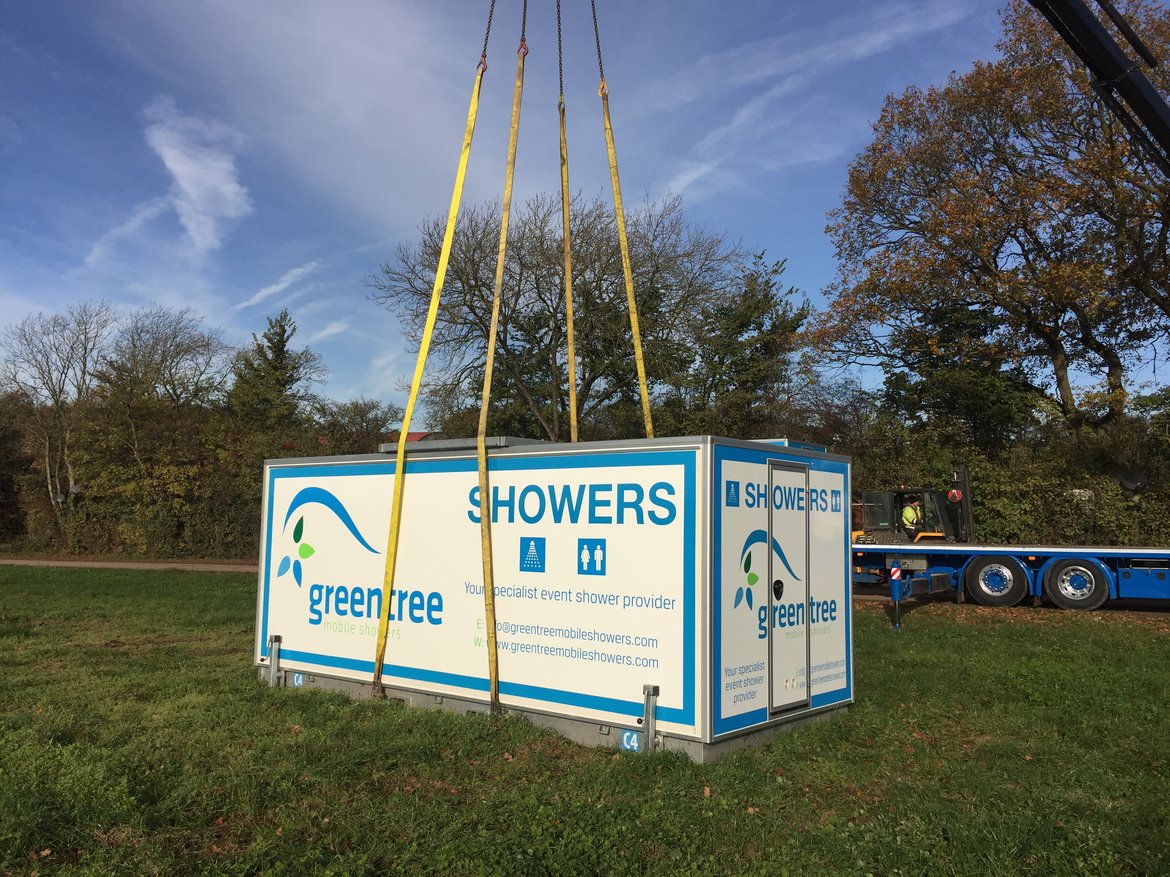 portable-shower-cabin-being-hoisted