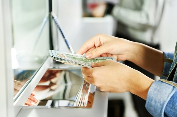customer-at-bank-teller-with-notes