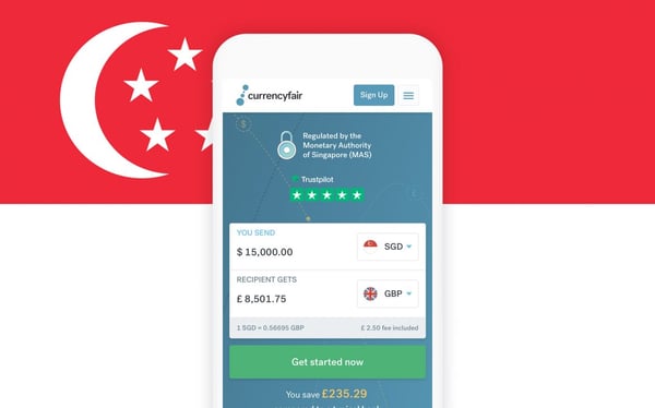 The CurrencyFair app on a phone in front of the Singapore flag.