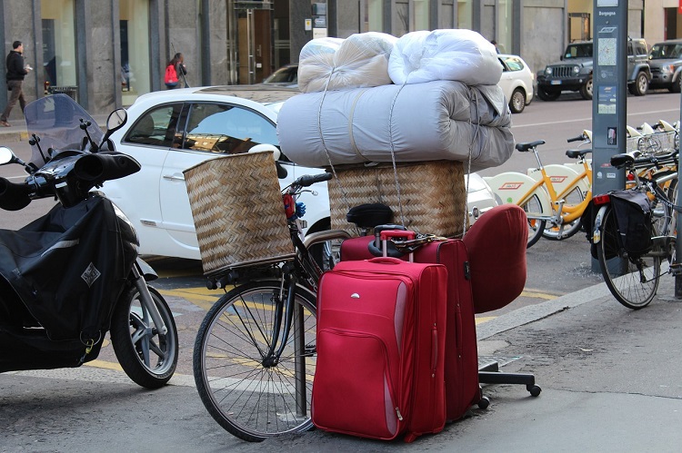 bicycle-stacked-with-cases-moving