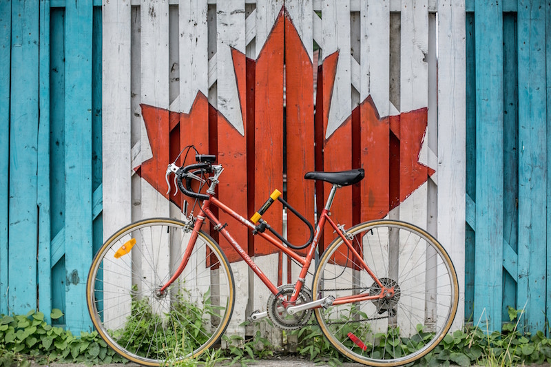 bicycle in front of mural of canada flag