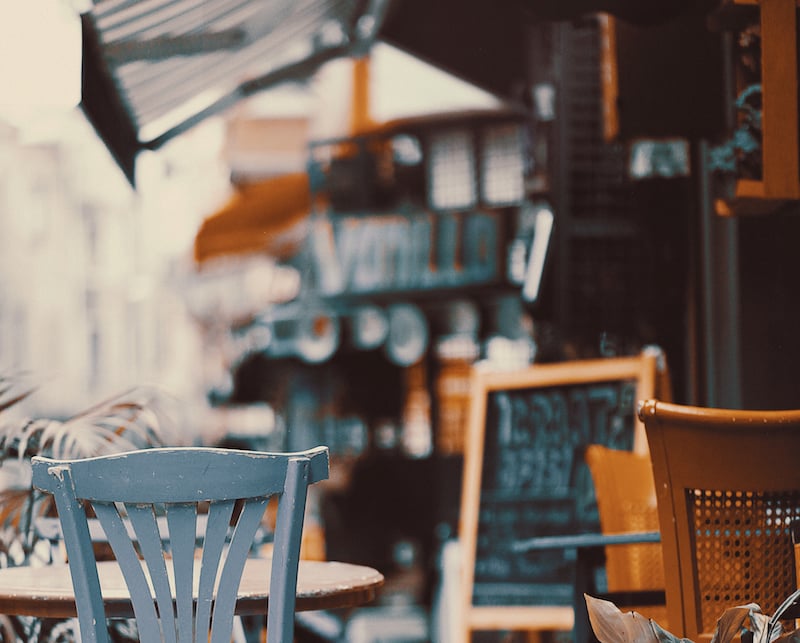 chairs on sidewalk outside cafe