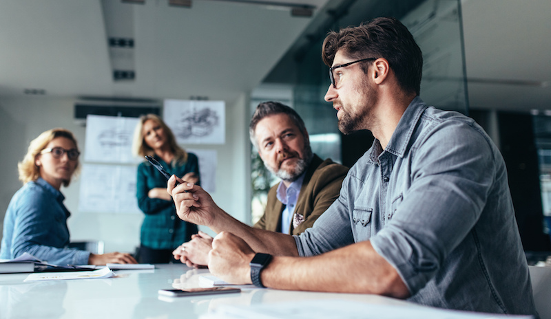 designer in meeting at table