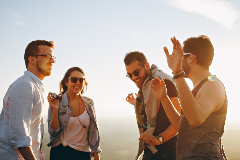 friends laughing in sunshine