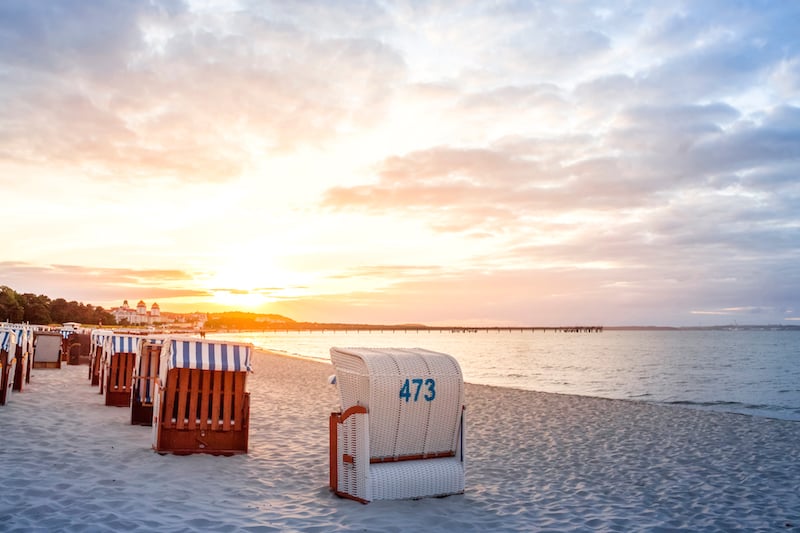 beach huts on beach at dawn germany