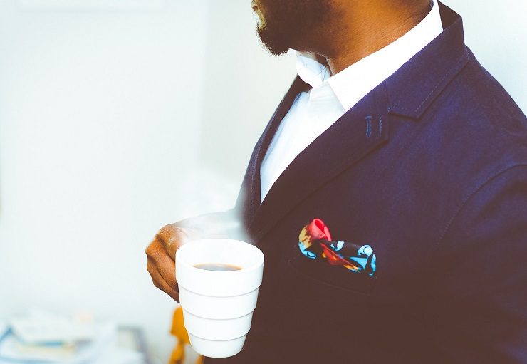 man-in-suit-with-coffee